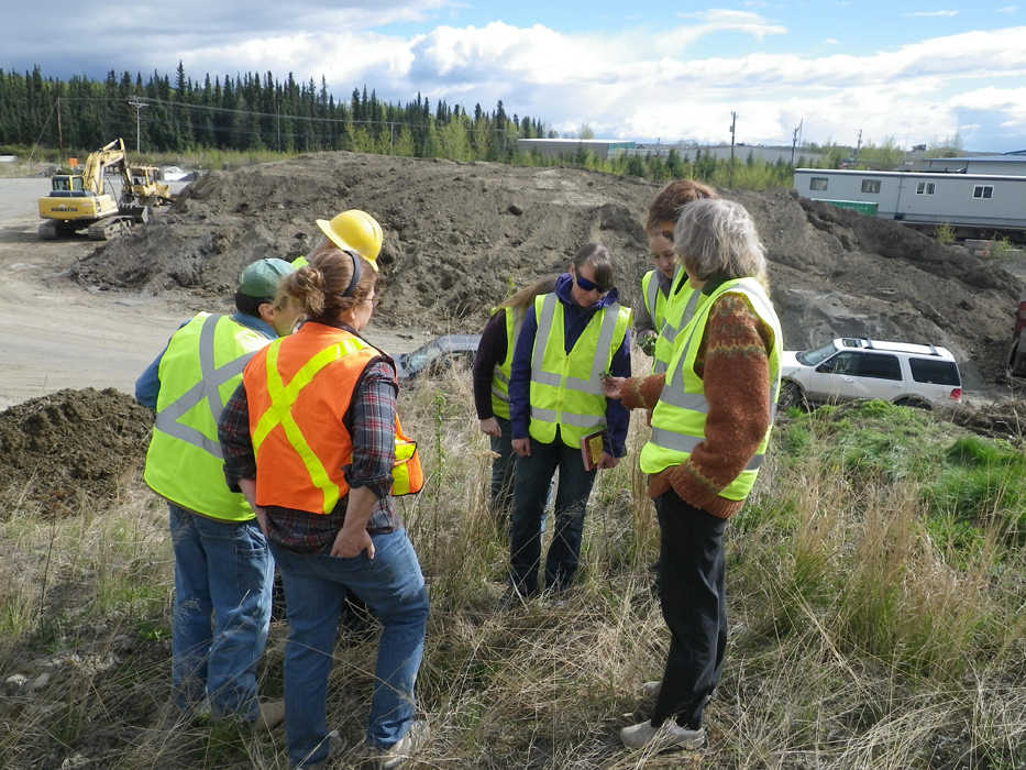 Participants in a class to train weed-free forage and gravel inspectors conduct a mock inspection of a Soldotna gravel pit on May 6. (Photo by Heidi Chay)
