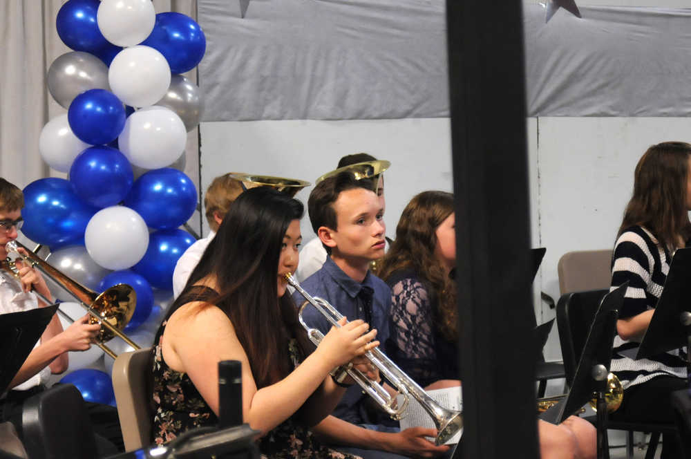 Photo by Elizabeth Earl/Peninsula Clarion The Soldotna High School band warms up before the school's graduation ceremony at the Soldotna Sports Complex on Wednesday, May 18, 2016.