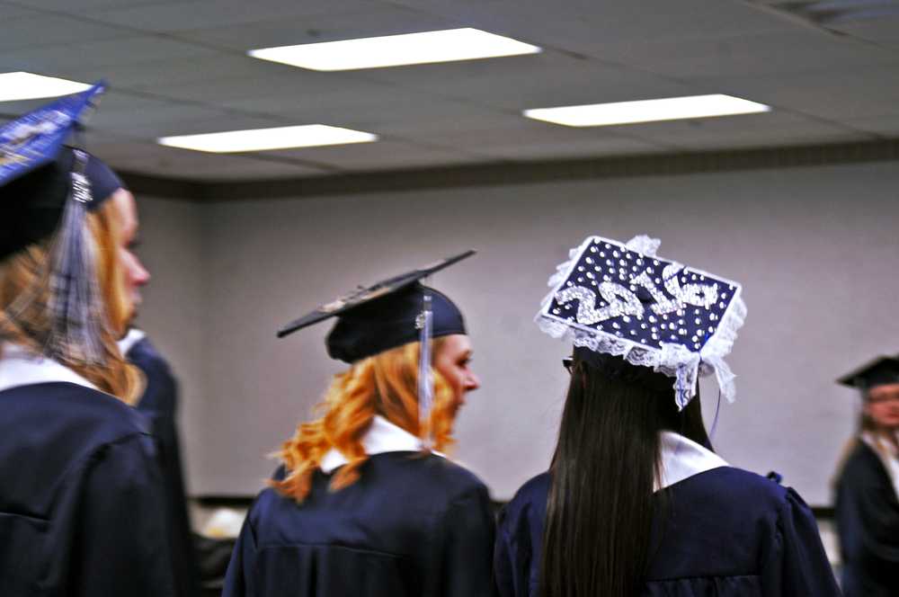 Photo by Elizabeth Earl/Peninsula Clarion Soldotna High School graduates prepared to walk across the stage for their graduation ceremony at the Soldotna Regional Sports Complex on Wednesady, May 18, 2016.