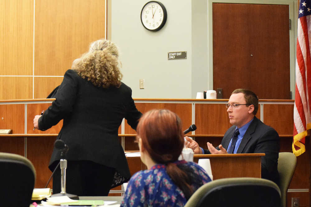 Photo by Megan Pacer/Peninsula Clarion  Defense Attorney Dina Cale discusses photo evidence with Investigator Kevin Vik of the Alaska Bureau of Investigation during the trial for Laurel Lee on Thursday, May 19, 2016 at the Kenai Courthouse in Kenai, Alaska. The Sterling woman accused of sexually assaulting a 14-year-old boy in October 2014.