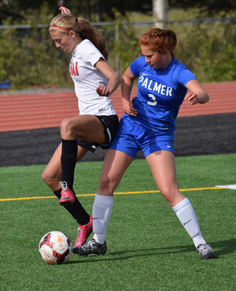 Photo by Joey Klecka/Peninsula Clarion Kenai Central's Samantha Morse (left) shields the ball from Palmer's Tiana Lee in a Northern Lights Conference tournament quarterfinal, Thursday at Ed Hollier Field in Kenai.