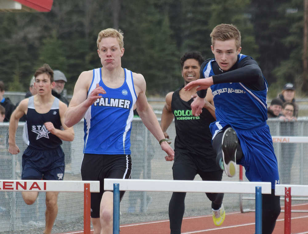 Photo by Joey Klecka/Peninsula Clarion Cook Inlet Academy junior Noah Leaf (right) reaches the first hurdle ahead of Palmer's Brady Southwick in the boys 110-meter hurdles April 23 at Kenai Central High School. Leaf claimed the win on his 17th birthday, and is a leading contender this weekend at the Region II track and field championships at Su Valley High School.