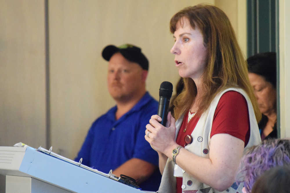 Photo by Megan Pacer/Peninsula Clarion  Kristie Sellers, director of behavioral health at Central Peninsula Hospital, addresses a crowd of around 170 community members during a town hall meeting to go over issues with area heroin abuse Thursday, May 19, 2016 at the Challenger Learning Center of Alaska in Kenai, Alaska.