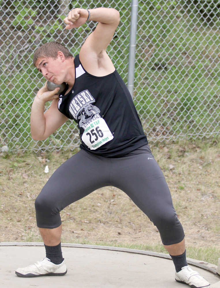 Nikiski's Luke Johnson competes in the shot put at the Region III/3A championships at Colony High School.