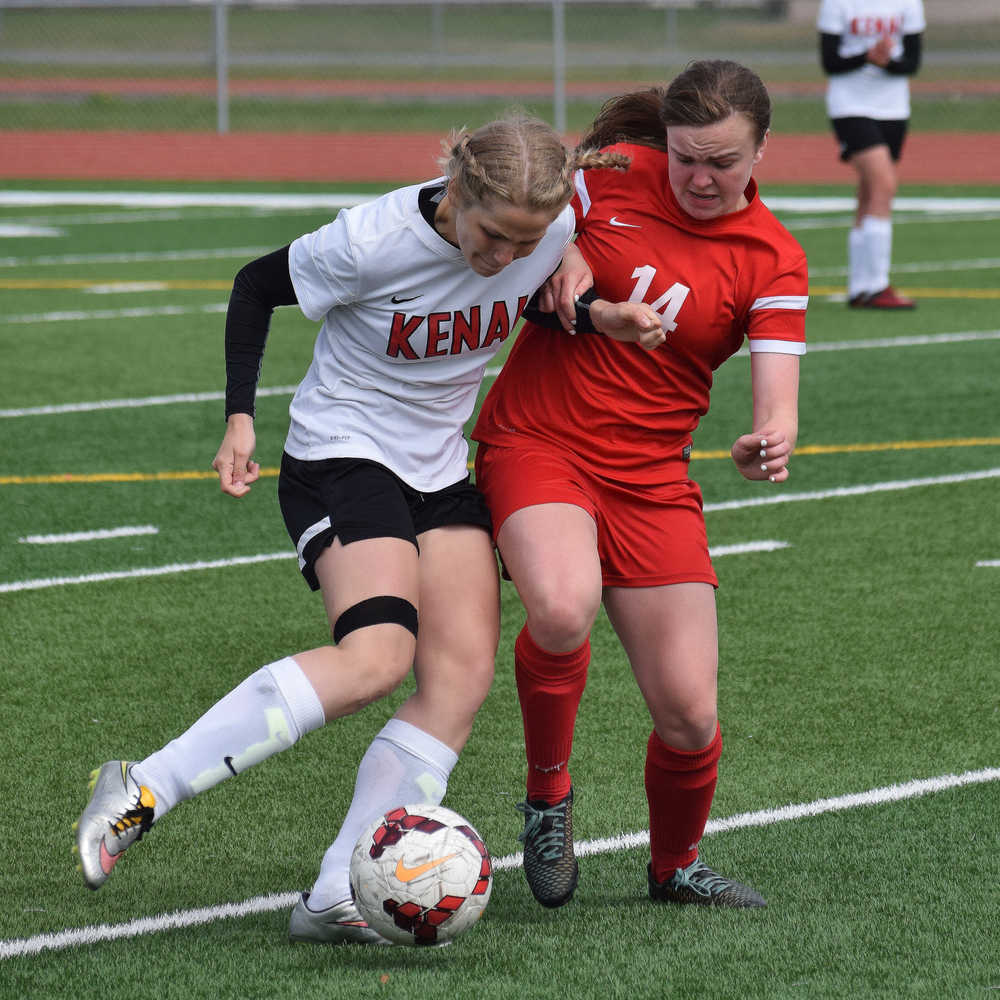 Photo by Joey Klecka/Peninsula Clarion Kenai Central midfielder Emily Halstead vies for the ball against Wasilla's Abby Crawford in Saturday's Northern Lights Conference championship game at Ed Hollier Field in Kenai.