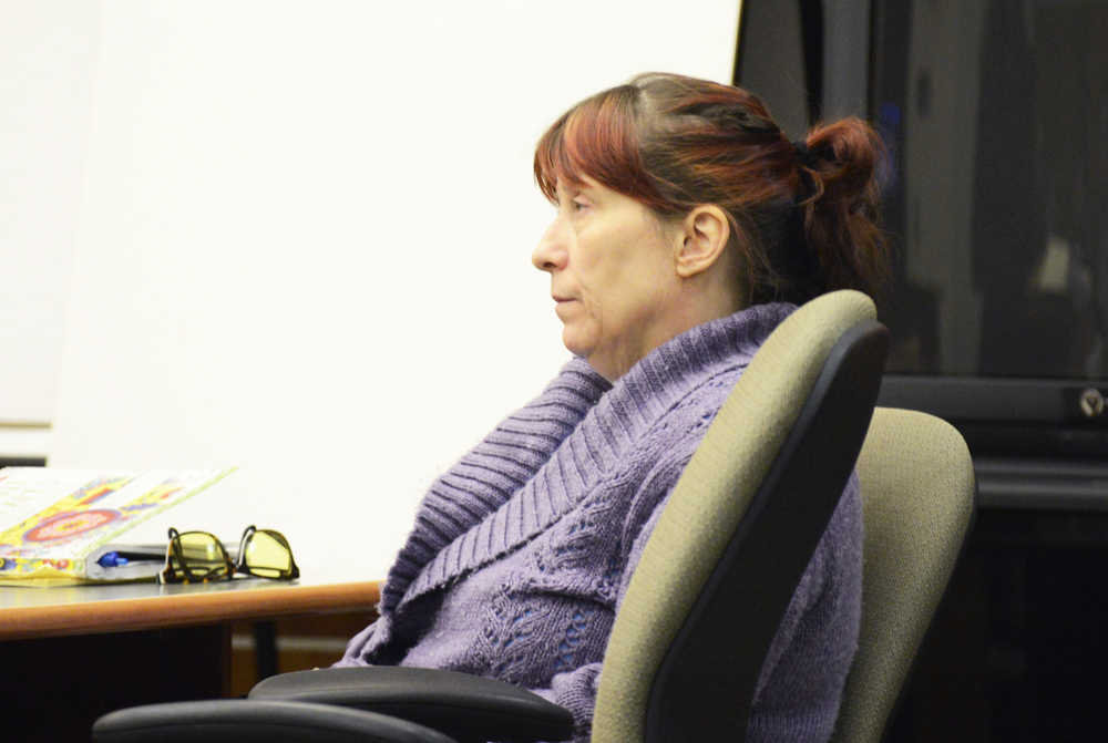 Photo by Megan Pacer/Peninsula Clarion  Laural Lee, 52, listens to closing arugments during the sixth day of trial Tuesday, May 24, 2016 at the Kenai Courthouse in Kenai, Alaska. Lee was charged with kidnapping, sexual assualt and sexual abuse of a minor in 2014 after being accused of attacking a then-14-year-old boy near the Sterling Highway.