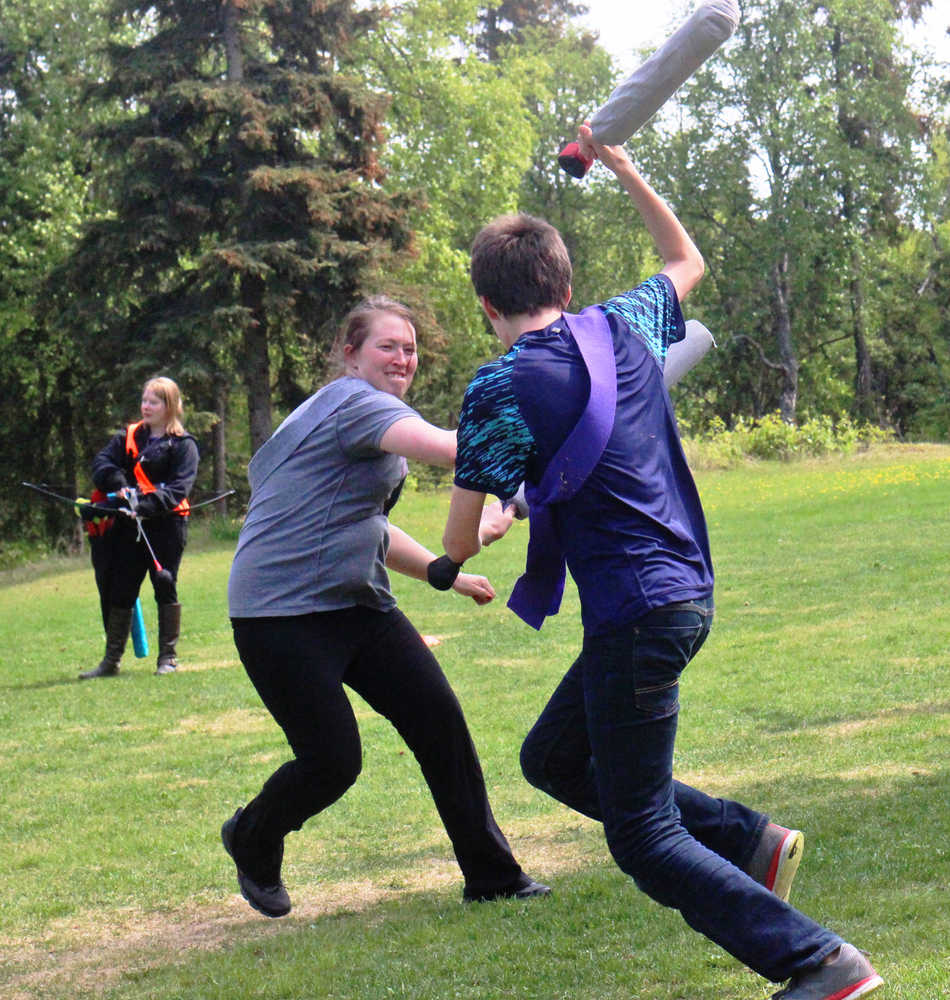 A.J Smith plays a minotaur during the Frozen Coast live-action role play group's weekly battle game on Sunday, May 22 in the Kenai Municipal Park.