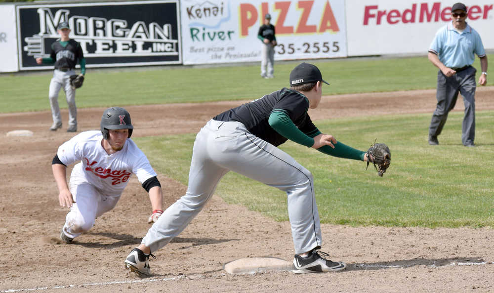 Photo by Jeff Helminiak/Peninsula Clarion Kenai's Sam Combs is tagged out trying to steal third base in the second inning by Colony's Zachary Satterly on Thursday at the Southcentral Conference tournament at Coral Seymour Memorial Park in Kenai.