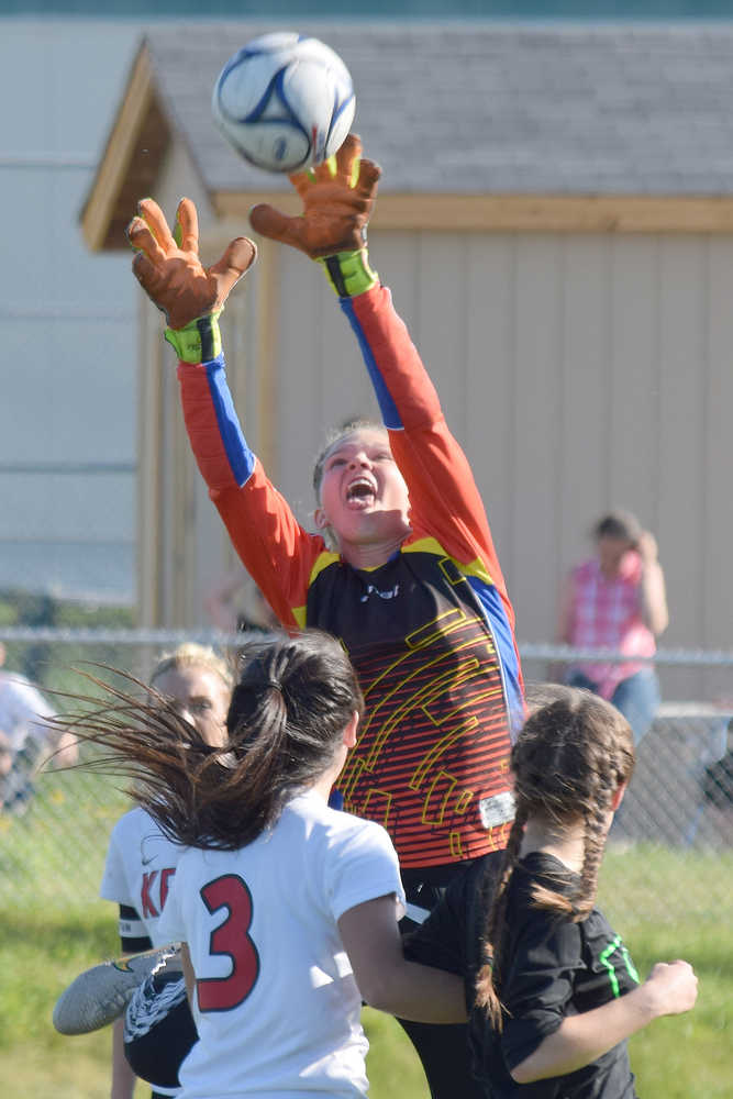 Photo by Joey Klecka/Peninsula Clarion Kenai Central goalkeeper Alli Steinbeck reaches up for a save against Colony in the ASAA state soccer tournament Thursday at Service High School.