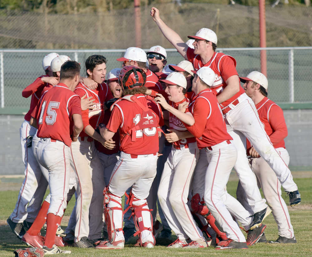 Photo by Jeff Helminiak/Peninsula Clarion Wasilla celebrates winning its third straight Southcentral Conference tournament title after topping Soldotna 5-0 on Friday at Coral Seymour Memorial Park in Kenai.