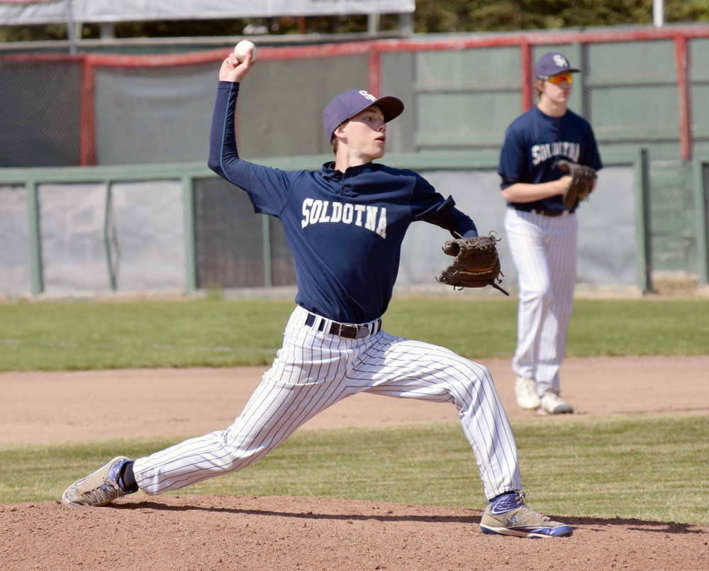 Photo by Jeff Helminiak/Peninsula Clarion Soldotna's Caleb Spence delivers home during his Saturday victory in the second place game of the Southcentral Conference tournament at Coral Seymour Memorial Park in Kenai.