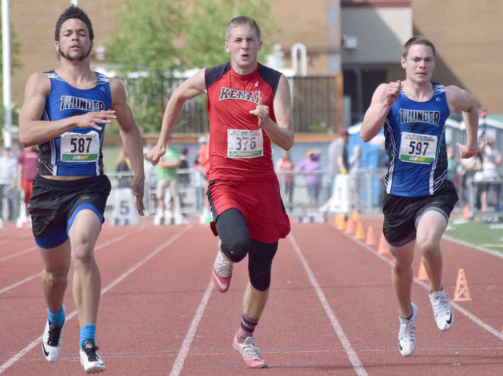 Photo by Joey Klecka/Peninsula Clarion Kenai Central junior Josh Jackman (376) makes a run to the line between two competing 100-meter sprinters Saturday at the state track and field championships at Dimond Alumni Field in Anchorage.
