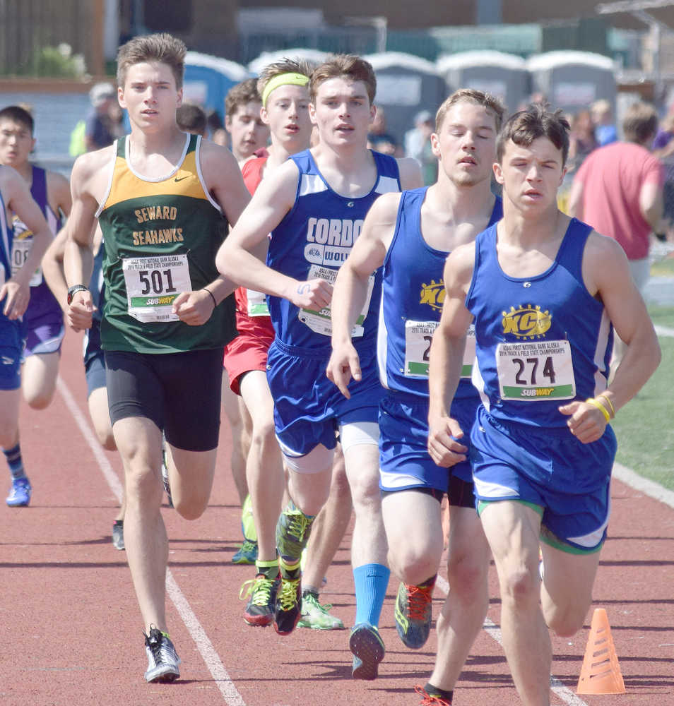 Photo by Joey Klecka/Peninsula Clarion Seward runner Hunter Kratz (501) races with a pack of contenders, including leader Kaleb Korta of Galena, in the 1-2-3A boys 1,600-meter race Saturday at the state track and field championships at Dimond Alumni Field in Anchorage.