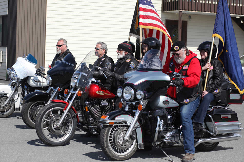 Photo by Kelly Sullivan/ Peninsula Clarion AMVETS Riders prepare to post the colors before the Memorial Day ceremony at Leif Handsen Memorial Park Monday, May 30, 2016, in Kenai, Alaska.