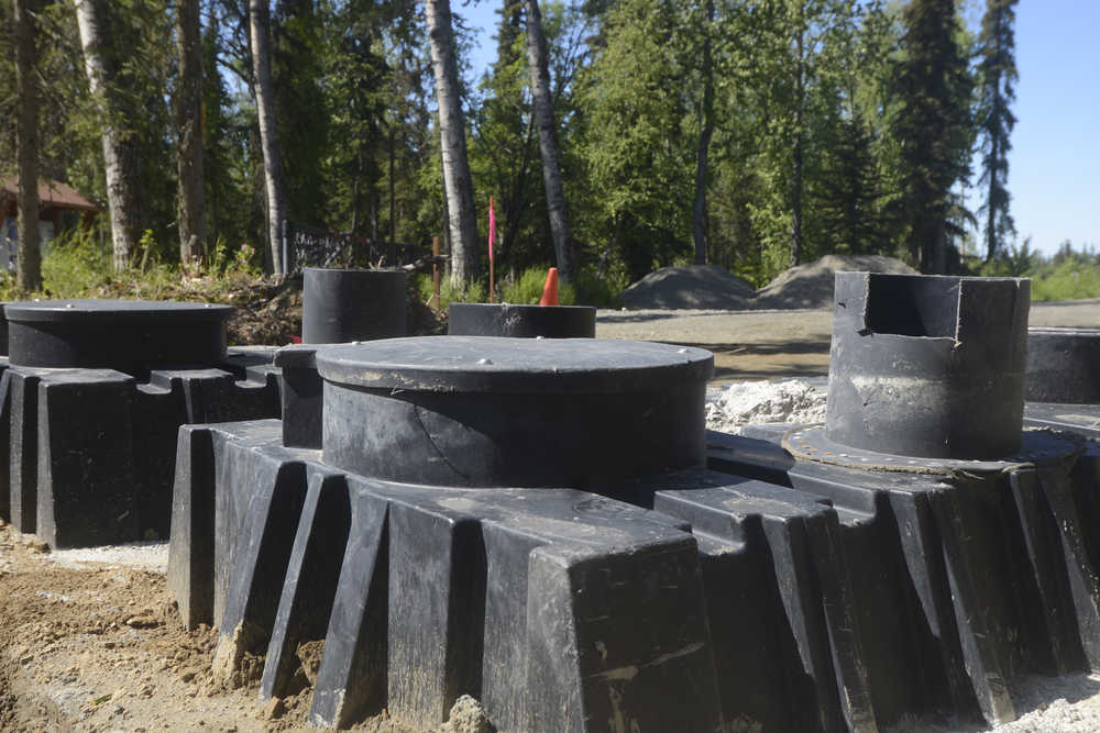 Photo by Megan Pacer/Peninsula Clarion This Wednesday, June 8, 2016 photo shows two tanks for outhouses installed in the ground at the Wolverine trailhead, part of the Tsalteshi Trails system, on just off Kalifornsky Beach Road in Soldotna. The outhouses themselves will be finished by mid September.