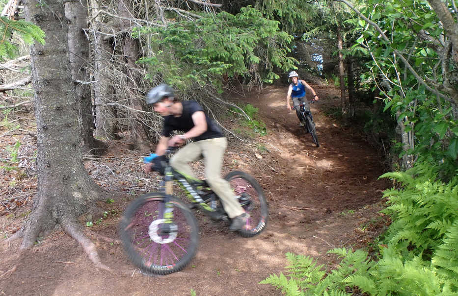 Caleb Rauch followed by Jacob Davis roasting a freshly groomed section of trail. (Photo by Derek Reynolds)