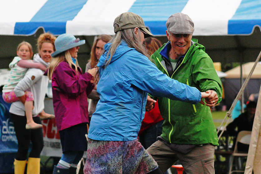 Barbara McNinch (left) dances with Tony Doyle at the Kenai River Festival on Friday, June 10, 2016 in  Soldotna Creek Park in Soldotna, Alaska. The festival, organized by the Kenai Watershed Forum, ended Sunday afternoon.