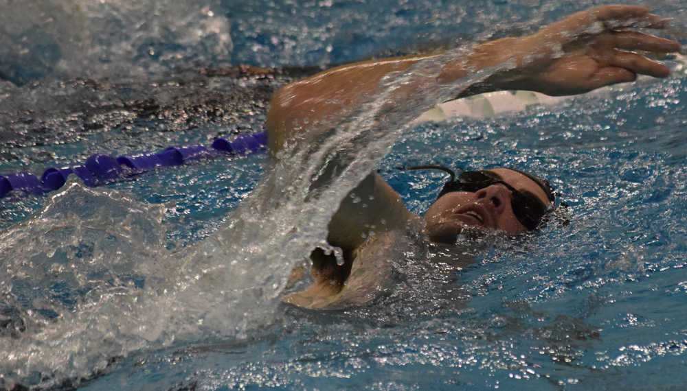 Photo by Jeff Helminiak/Peninsula Clarion Sprint competitor Lee Frey of Soldotna competes in the 500-yard swim portion of Tri the Kenai on Sunday at Skyview Middle School.