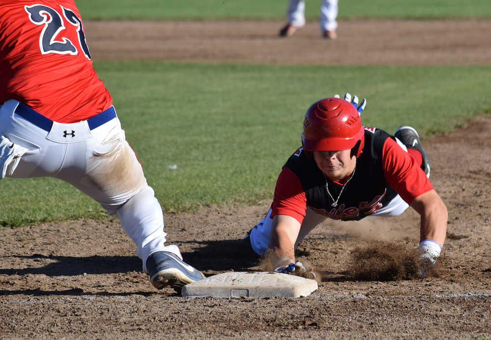 Photo by Joey Klecka/Peninsula Clarion Peninsula Oilers catcher Jonathan Washam tags up to first base ahead of Fairbanks Goldpanner baseman Steven Weber, Tuesday at Coral Seymour Memorial park in Kenai.