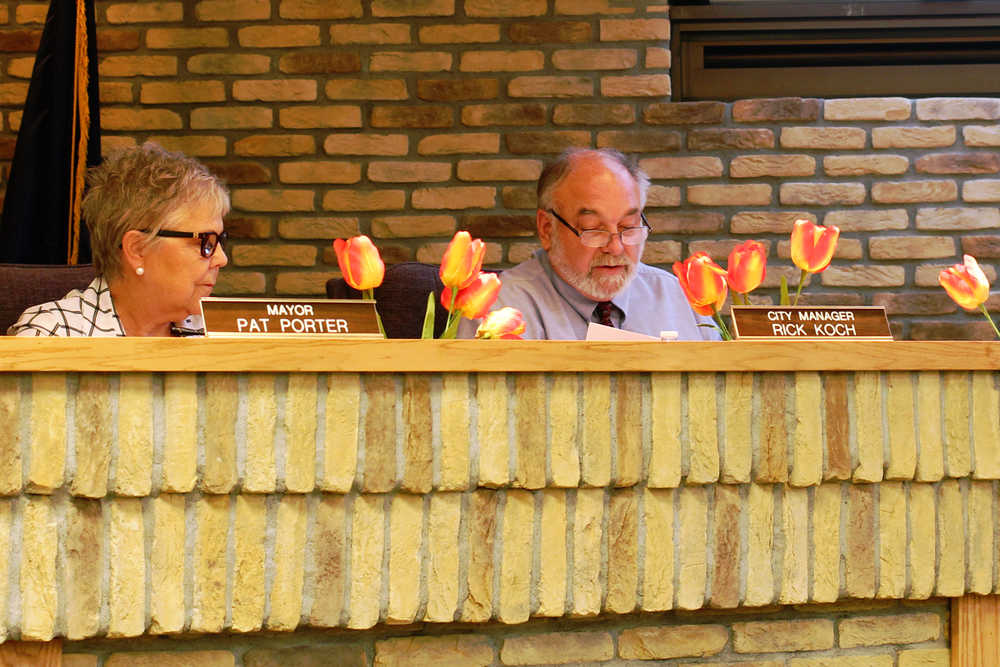 Photo by Ben Boetgger/Peninsula Clarion Kenai Mayor Pat Porter listens as Kenai City Manager Rick Koch reads a letter of resignation at a Kenai City Council meeting Wednesday, June 15, 2016 at City Hall Council Chambers in Kenai, Alaska.