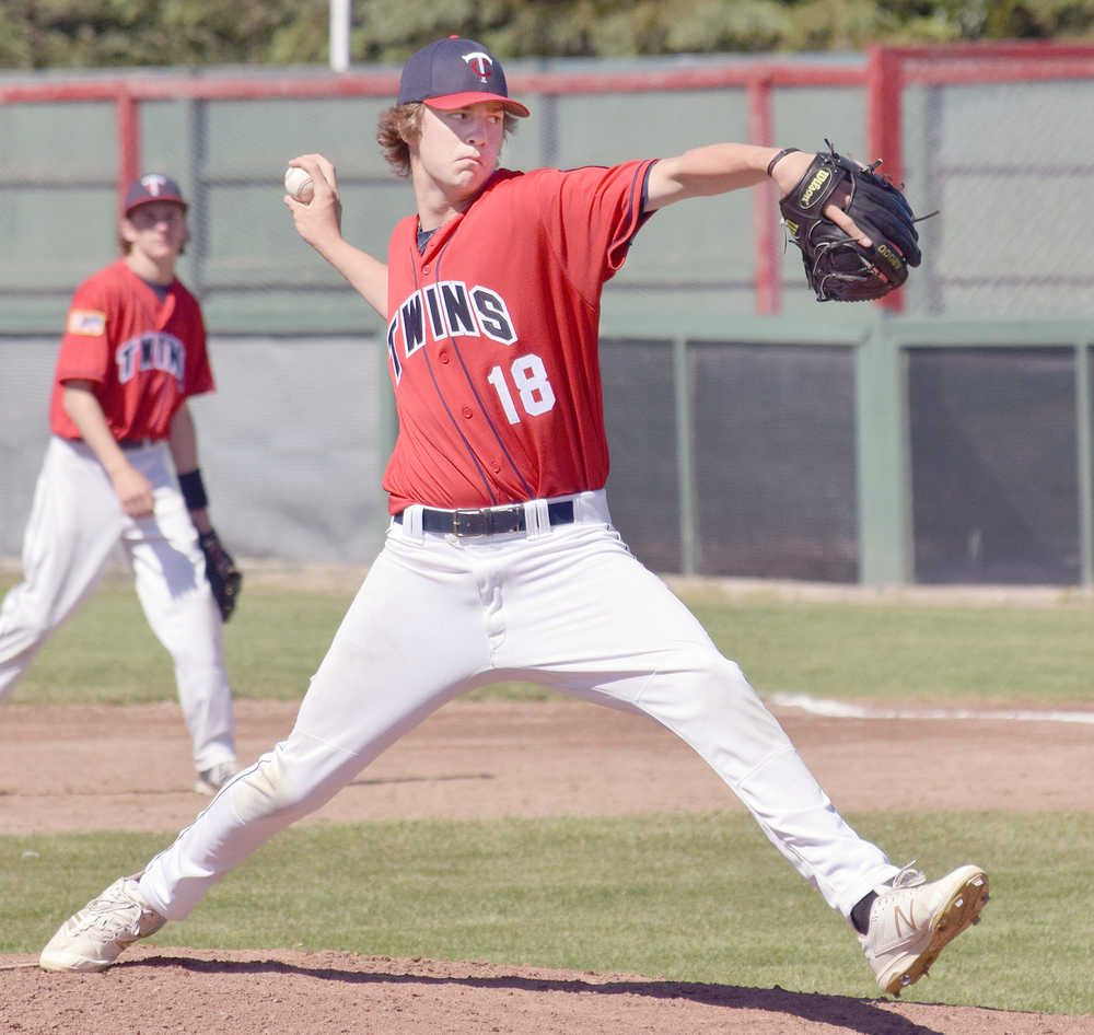 Photo by Joey Klecka/Peninsula Clarion Post 20 Twins pitcher Joey Becher delivers a throw against West Post 1 Thursday afternoon at Coral Seymour Memorial Park in Kenai.