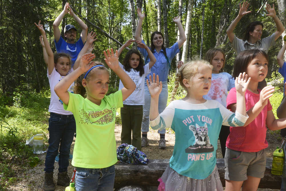 Photo by Megan Pacer/Peninsula Clarion Area children going into second and third grade perform a song and dance about the water cycle during "Fish Day" at a Kenai National Wildlife Refuge Critter Camp on Wednesday, June 22, 2016 at the refuge visitor center in Soldotna, Alaska. Each day in the camp session, led by Education Specialist Michelle Ostrowski and education interns, has its own outdoor theme. The kids spent Wednesday learning about the water cycle, streams and other things to do with fish.