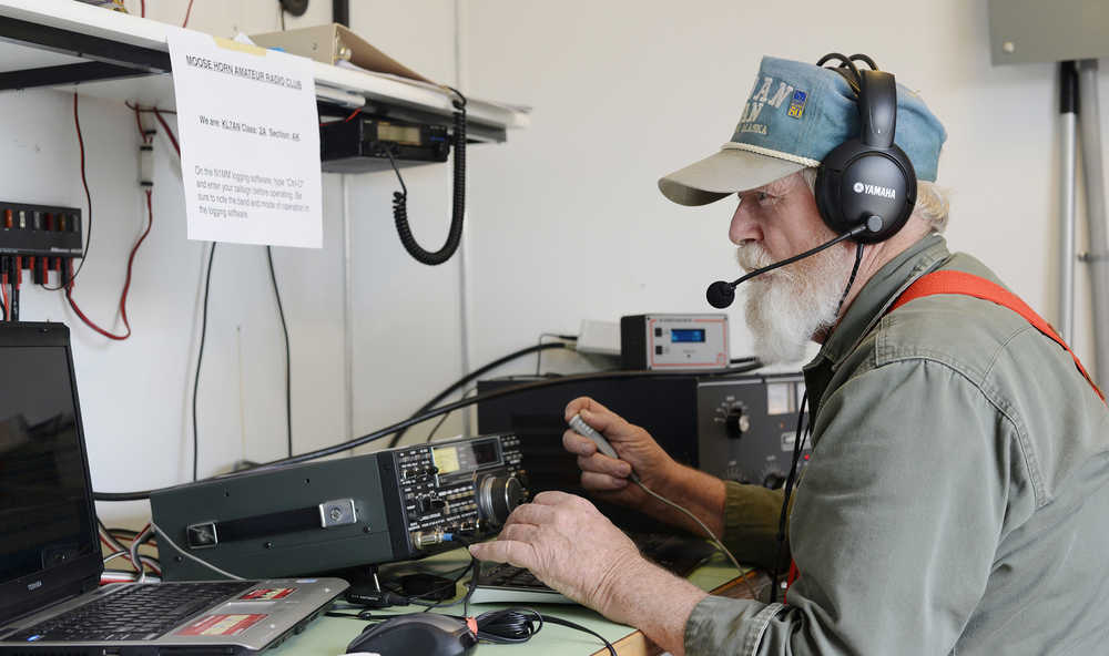 Members of the Moose Horn Amateur Radio club raise a portable antennae tower during ham Radio Feild Day on Saturday, June 25, 2016 at Skyview Middle School in Soldotna, Alaska. Members of the club spent 24 hours working two transmitters from their trailer in the Skyview parking lot in a nation-wide competition to make the greatest number of contacts with other amateur radio operators.