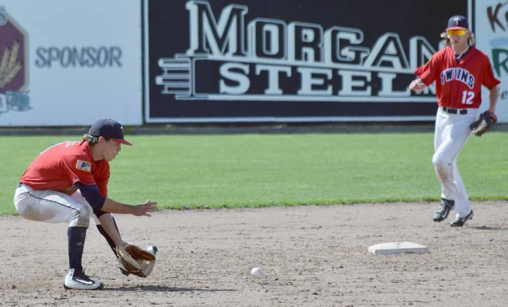 Photo by Jeff Helminiak/Peninsula Clarion American Legion Twins shortstop Josh Darrow eats up a ground ball before throwing to first for an out Sunday against Kodiak at Coral Seymour Memorial Park in Kenai.