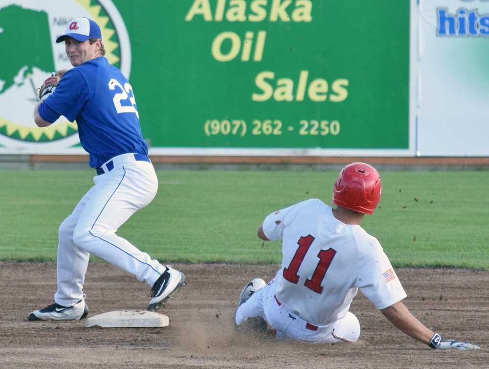 Photo by Jeff Helminiak/Peninsula Clarion Glacier Pilots shortstop Jack Gerstenmaier forces out Oilers' Darius Hill at second base in the first inning Monday at Coral Seymour Memorial Park in Kenai. Gerstenmaier could not turn the double play.