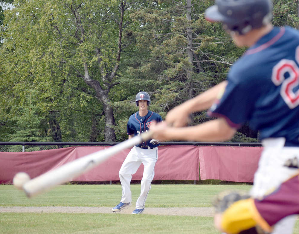 Photo by Joey Klecka/Peninsula Clarion Post 20 Twins third baseman Tyler Covey keeps an eye on teammate Cody Quelland's bat Thursday afternoon at the Kenai Little League fields.