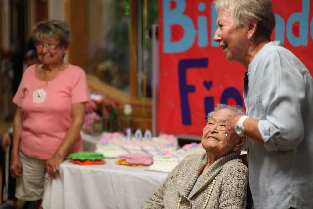 Photo by Kelly Sullivan/ Peninsula Clarion Fiocla Wilson listens to Evelyne Boulett reminisce about growing up a friend the Wilson family Thursday, June 30, 2016, at Heritage Place in Soldotna, Alaska.
