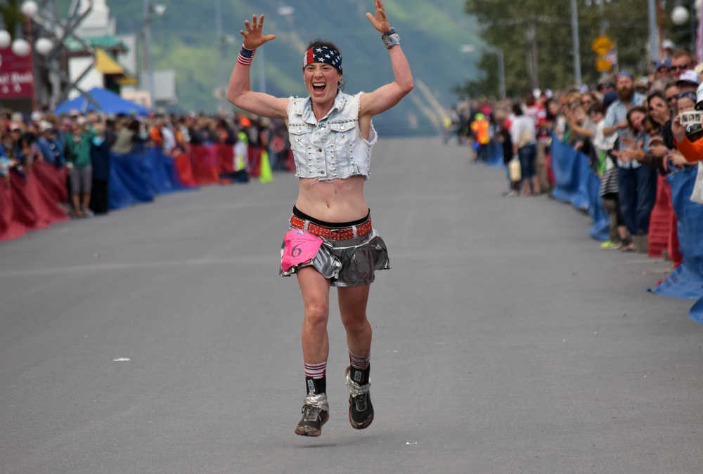 Photo by Jeff Helminiak/Peninsula Clarion Seward's Aubrey Smith summons a little energy before a seventh-place finish Monday in the women's Mount Marathon race in Seward.