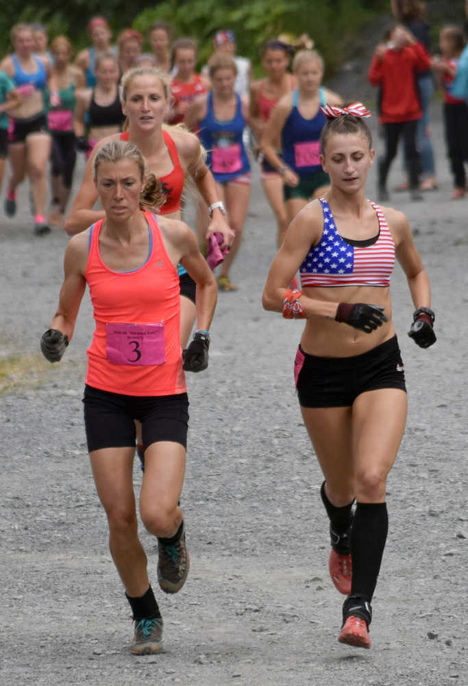 Photo by Jeff Helminiak/Peninsula Clarion Christy Marvin, the champion, and Denali Foldager-Strabel, the third-place finisher, lead the pack to the mountain Monday at the women's Mount Marathon race in Seward.
