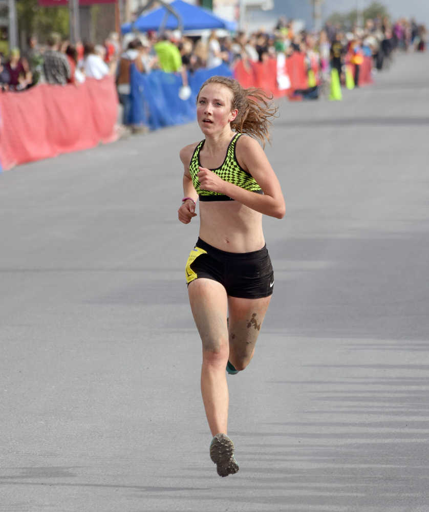 Photo by Jeff Helminiak/Peninsula Clarion Kenai Central junior Riana Boonstra finishes second in the junior girls race Monday in Seward.