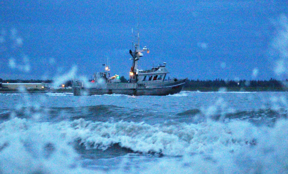 A commercial fishing boat leaves the mouth of the Kenai river for a day of fishing in Cook Inlet on Monday, July 4 in Kenai.