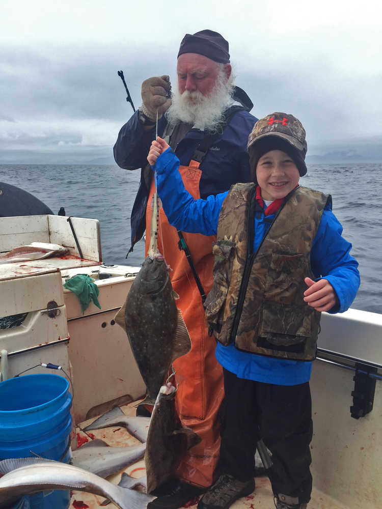 Photo courtesy Susie Morris Baker Ben Baker, 10, of Augusta, Georgia, proudly displays two halibut that he caught with Aron Hanson (left) on a charter boat out of Homer. The possession limit for 2016 in Area 3A, which includes the central Gulf of Alaska, is two fish per person per day, with a limit of four total in possession, according to the International Pacific Halibut Commission. The average size fish caught out of the Homer port is 10.85 pounds this season, ranging between 2.6 pounds and 86.6 pounds, according to the Lower Cook Inlet sportfishing report for the week of July 6.