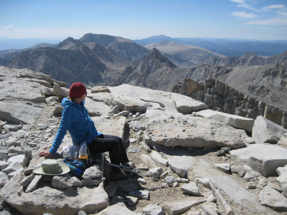 Photo courtesy Kathy Clark Kathy Clark sits at 14,505 feet above sea level on the summit of Mount Whitney in California.