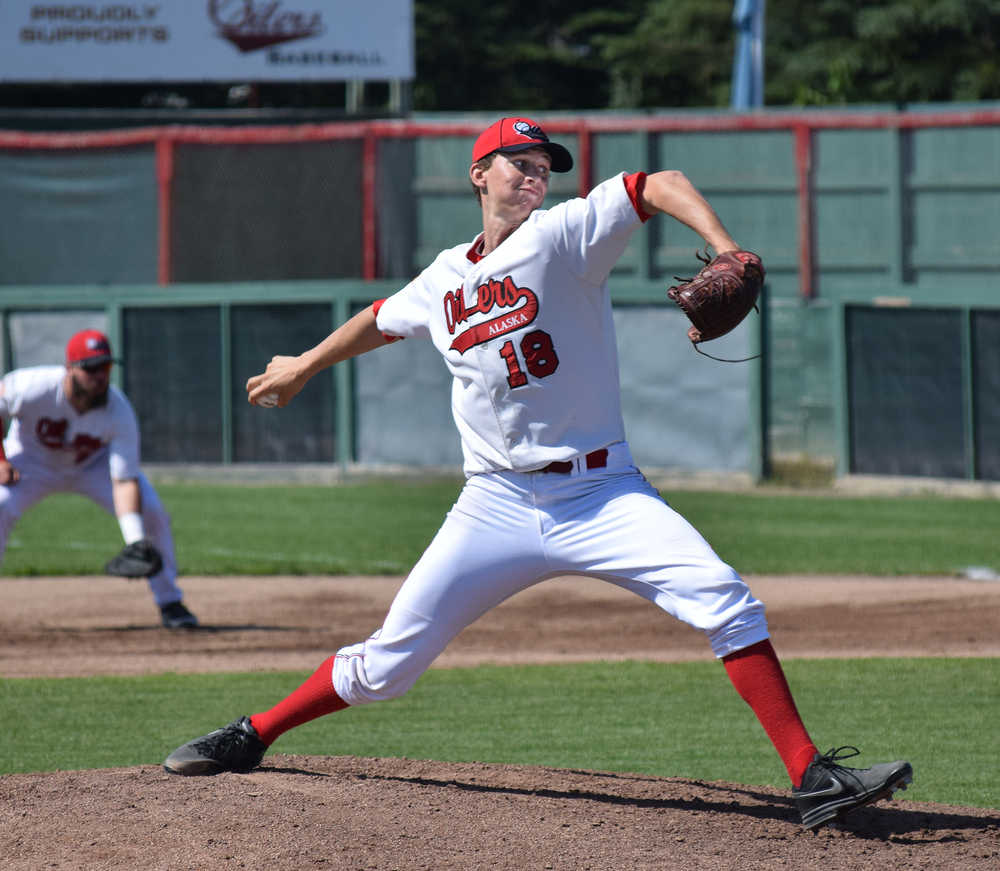 Photo by Joey Klecka/Peninsula Clarion Peninsula Oilers right-hander Justin Montgomery (18) winds up for the pitch Sunday afternoon against the Mat-Su Miners at Coral Seymour Memorial Park in Kenai.