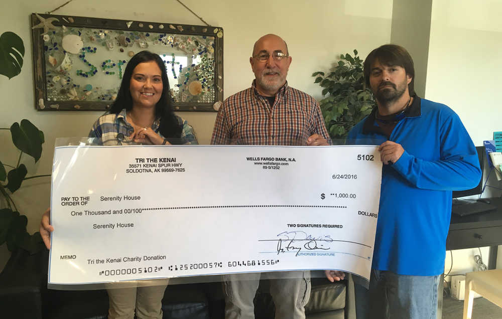 Tri the Kenai triathlon race director Tony Oliver, center, recently presented Serenity House with a donation of $1,000 raised during the triathlon. Pictured with Oliver are Serenity House staff Jodi Lout and Pete Parquette. The donation will go toward the Change 4 the Kenai Drug Prevention program (http://www.change4kenai.org/).