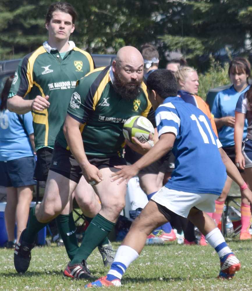 Photo by Jeff Helminiak/Peninsula Clarion Bob Toski of the Kenai River Wolfpack sizes up a player on the Manu Bears on Saturday at the Kenai Dipnet Fest Rugby 10s Tournament in Kenai.