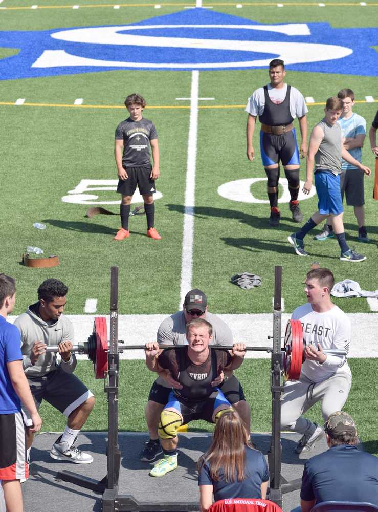 Photo by Jeff Helminiak/Peninsula Clarion Austin Schrader, who had the top Wilks Coefficient, competes at the USA Powerlifting Justin Maile Classic on Saturday at Justin Maile Field in Soldotna.