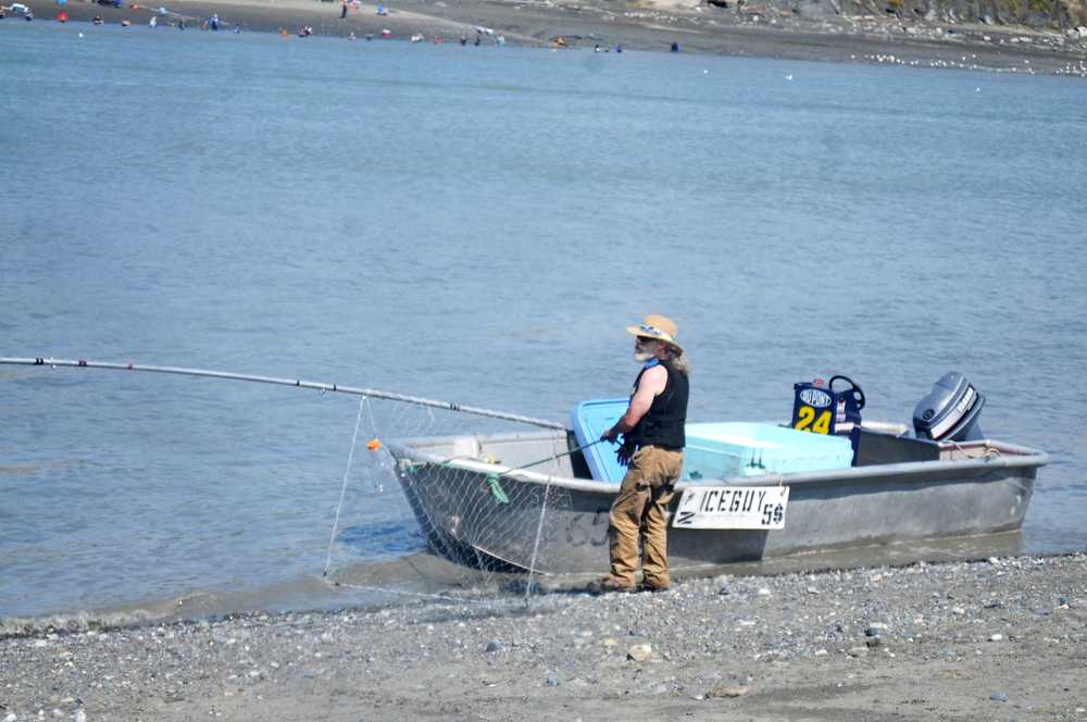 Photo by Elizabeth Earl/Peninsula Clarion A salesman parks his boat on the edge of Kenai River on Monday, July 18, 2016 in Kenai, Alaska. Vendors have focused in on the personal use dipnet fishery in Kenai as a new market to reach.