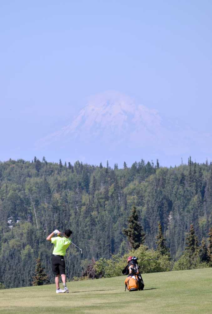 Photo by Jeff Helminiak/Peninsula Clarion Jack Newell of Eagle River hits into the 13th green Tuesday during the Birch Ridge Jr Masters at Birch Ridge Golf Course in Soldotna.