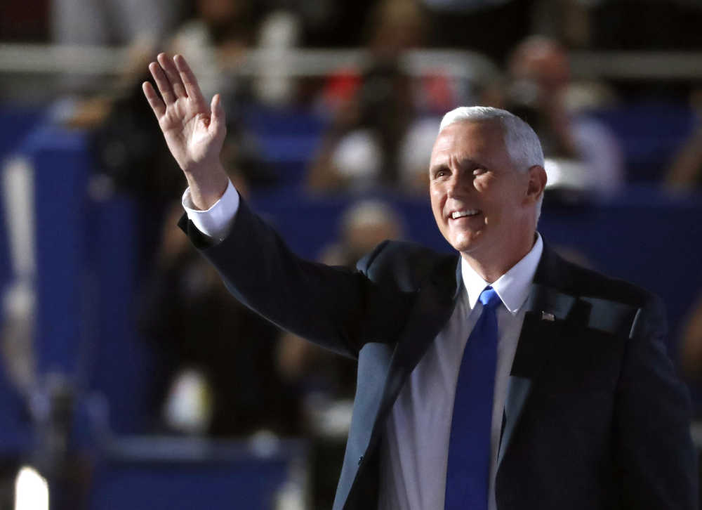 Republican Vice Presidential Nominee Gov. Mike Pence of Indiana waves as he takes the stage during the third day of the Republican National Convention in Cleveland, Wednesday, July 20, 2016. (AP Photo/Paul Sancya)