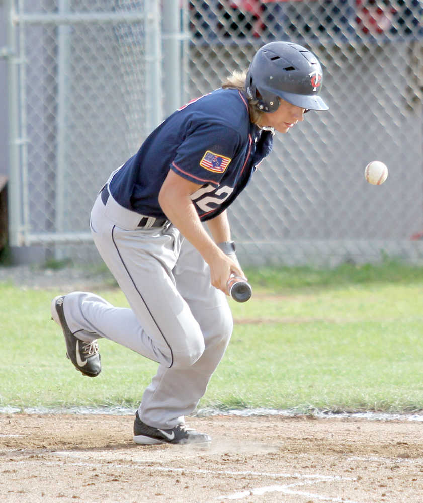 Kenai's JJ Sonnen bunts the ball foul during a 5-4 win over the Wasilla Road Warriors Thursday, July 21, 2016, at McManus Field in Wasilla.