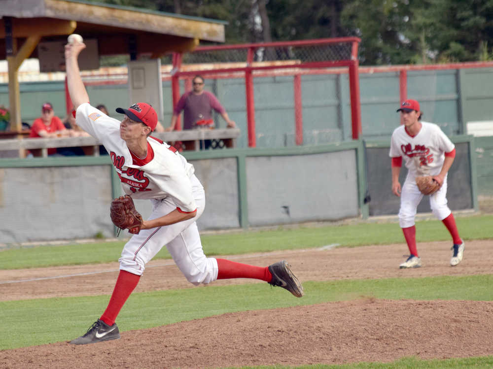 Photo by Jeff Helminiak/Peninsula Clarion Oilers starter Justin Montgomery pitches against the Anchorage Bucs on Wednesday at Coral Seymour Memorial Park in Kenai.