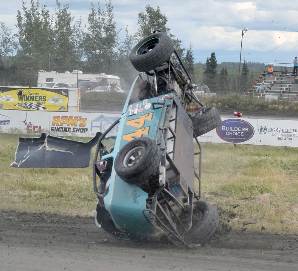 Photo by Joey Klecka/Peninsula Clarion Legends driver Ty Torkelson goes for a wild ride Saturday at Twin City Raceway in Kenai. Torkelson got out of his car and walked away.