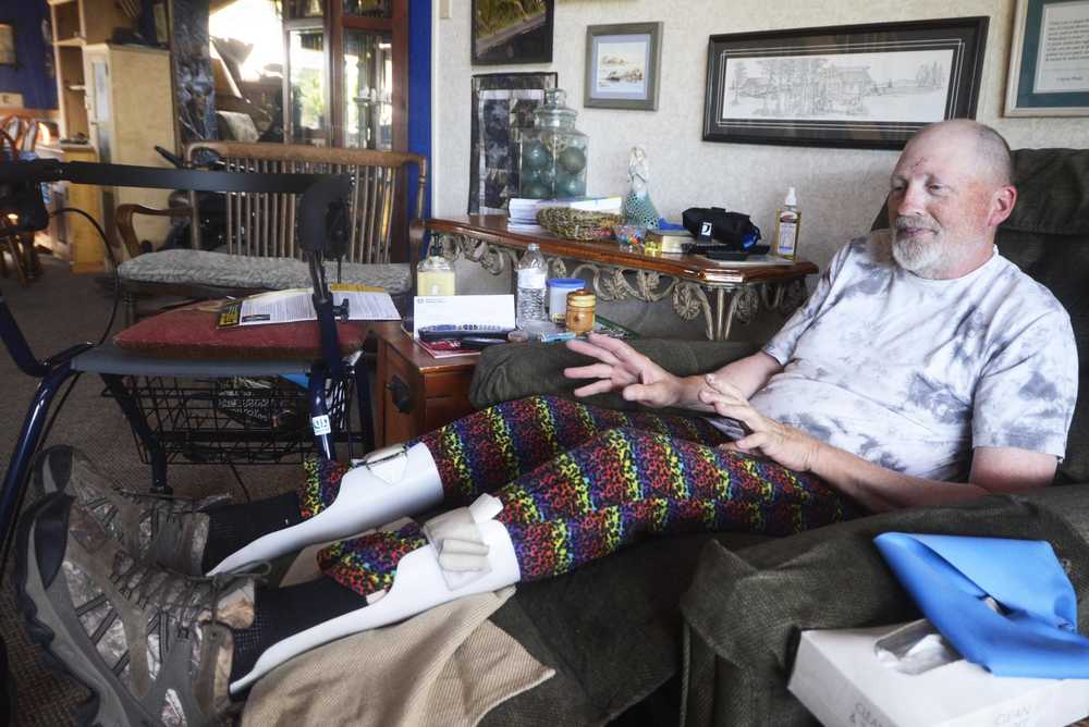 Photo by Megan Pacer/Peninsula Clarion Bill Parker talks to his wife, Shoney, in their bluff-side home Thursday, July 21, 2016 in Happy Valley, Alaska. After years of struggling to get services and medical care through the Department of Veterans Affairs, Parker said things are running more smoothly since he enrolled in the Veteran-Directed Home and Community Based Services Program, offered for the first time in Alaska through the Independent Living Center of the Kenai Peninsula.