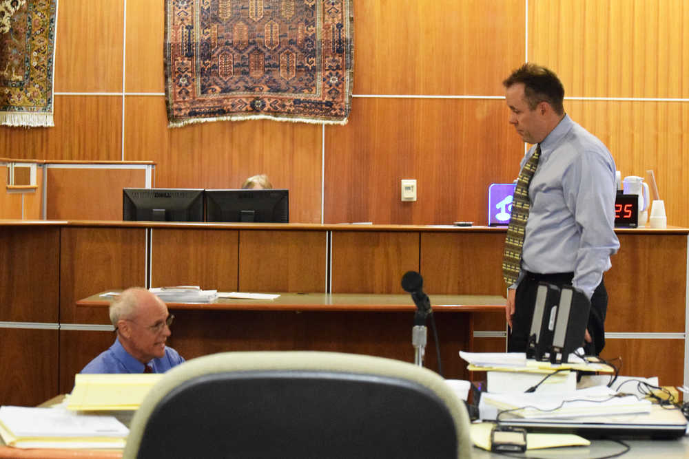 Photo by Megan Pacer/Peninsula Clarion District Attorney Scot Leaders watches during cross examination while expert witness Ross Gardner, a crime scene reconstructionist, demonstrates body positions in the second day of a sentencing Wednesday, Aug. 3, 2016, at the Kenai Courthouse in Kenai, Alaska. Iraq War veteran Paul Vermillion, of Anchorage, pleaded guilty to one count of manslaughter for the December 2013 death of Genghis Muskox in Cooper Landing.
