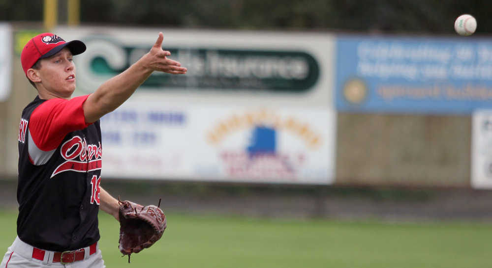 Peninsula Oilers starter Justin Montgomery flips a ball to first after fielding a grounder during the first game of the best-of-3 Alaska Baseball League Top of the World Series Saturday, Aug. 6, 2016, at Hermon Brothers Field in Palmer.